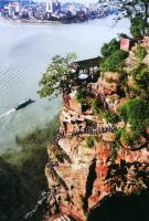 carved stone buddha seeing the river